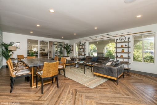 a living room and dining room with a large table and chairs at Runaway Bay Apartments, Columbus, 43204