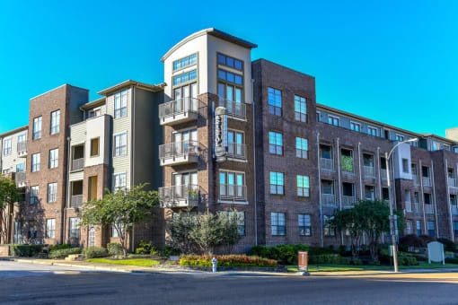 a large apartment building on a street corner at Bristol On Union Apartment Homes, Memphis, TN