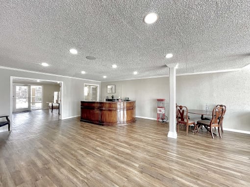 a large living room with a bar in the center at Cambridge Village Apartments, Houston, TX 77045 ? 