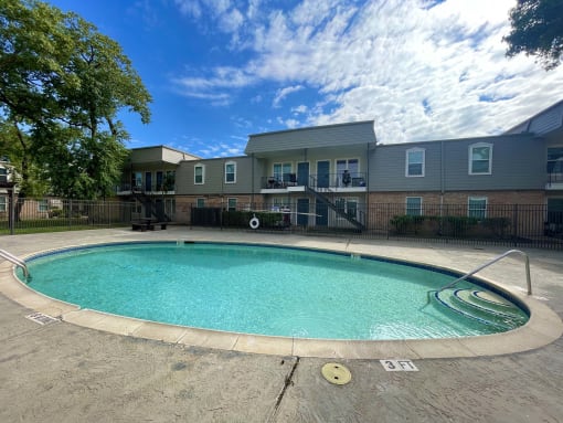 the preserve at ballantyne commons pool with apartment buildings at Cambridge Village Apartments, Texas, 77045