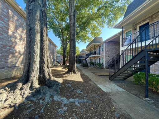 our apartments are located in a quiet neighborhood with trees at Tara Oaks in Houston, TX