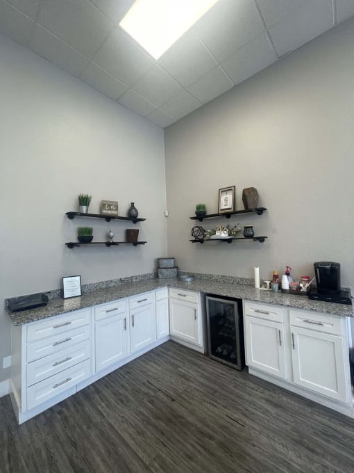a kitchen with white cabinets and a counter top at Whispering Oaks, Conroe, TX 77301 ? 