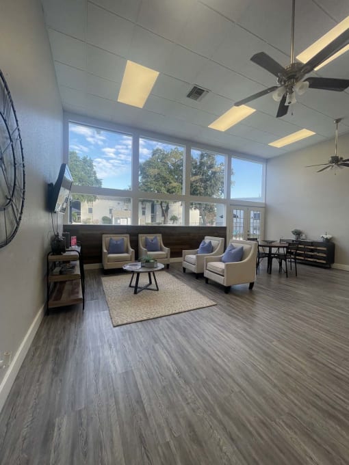a living room with couches and chairs and a large window at Whispering Oaks, Conroe, TX ? 