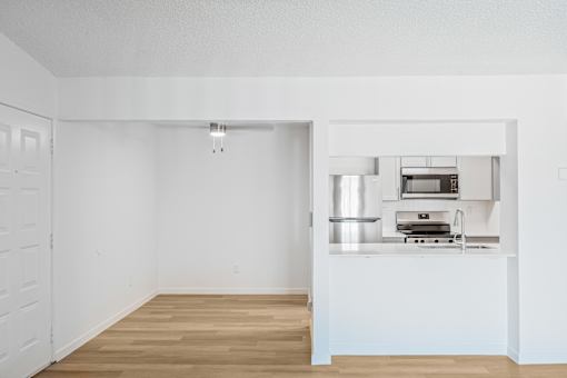 A kitchen with a stove top oven and a sink at Water Ridge Apartments , Irving