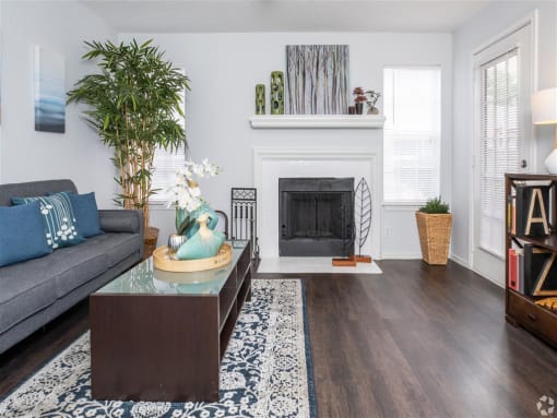 Luxurious Living Room Remodel With Standard Fireplace at Wildwood Apartments, CLEAR Property Management, Austin, TX, 78752