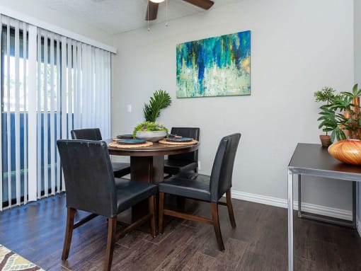a dining room with a table and chairs at Water Ridge Apartments, Irving, Texas
