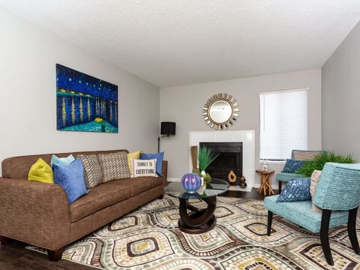 a living room with a couch and a chair at Water Ridge Apartments, Irving, TX 75061