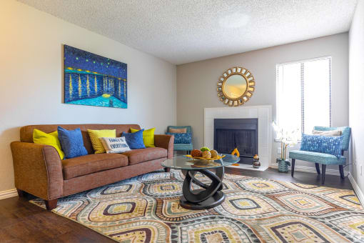 a living room with a couch and a coffee table at Water Ridge Apartments, Irving