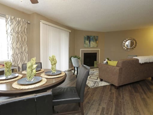a living room and dining room with a table and chairs at Water Ridge Apartments, Texas, 75061