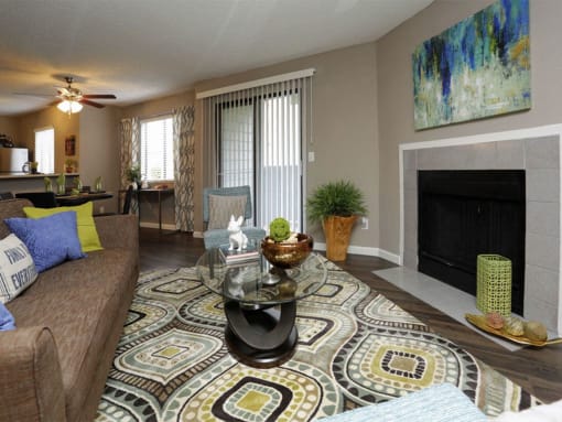 a living room with a couch and a coffee table at Water Ridge Apartments, Irving, TX