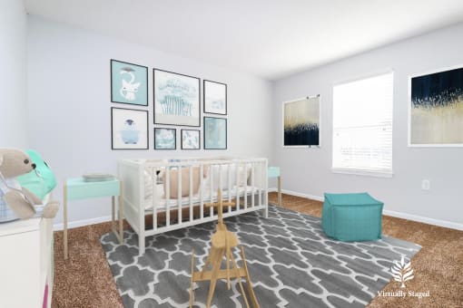 a nursery with a white crib and a blue ottoman