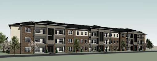 A large apartment building with multiple balconies and doors.