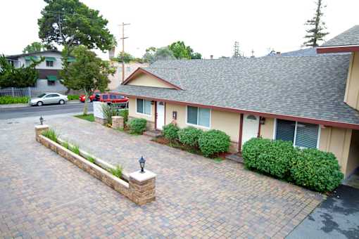 a view of the front of a house with a driveway