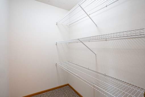 Empty white shelving in a room. Fargo, ND Stonebridge Apartments