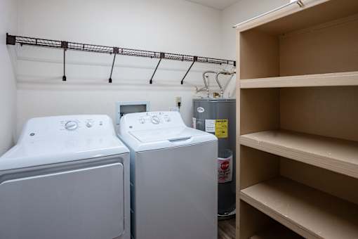 Two front loading washing machines in a laundry room. West Fargo, ND Clearview Apartments