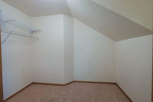 a closet with a shelf. Fargo, ND Bridgeport Apartments