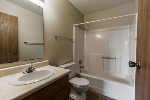 Grand Forks, ND Carling Manor Apartments. a bathroom with a sink toilet and bathtub