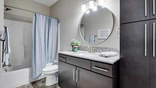 a bathroom with a sink and a toilet. Circle Pines, MN Lexington Lofts