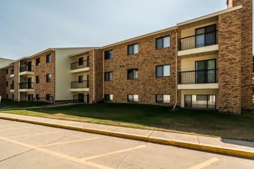 Grand Forks, ND Columbia West Apartments. Exterior of a three story apartment building