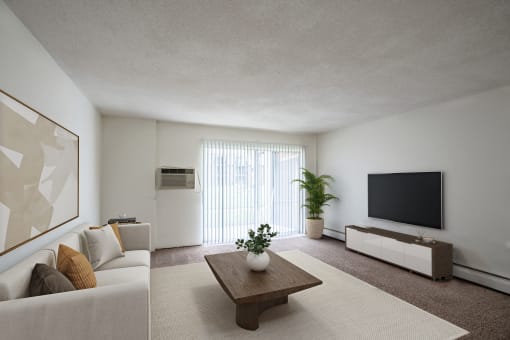 a living room with a couch and a coffee table. Coon Rapids, MN Robinwood Apartments