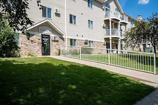 apartment with an office sign above the door. Bismarck, ND Sierra Ridge Apartments