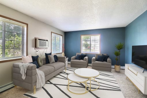 Fargo, ND Foxboro Townhomes. a living room with couches and a coffee table