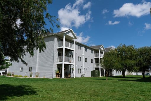 Fargo, ND Lake Crest Apartments. A large apartment complex with a grassy area in front of it