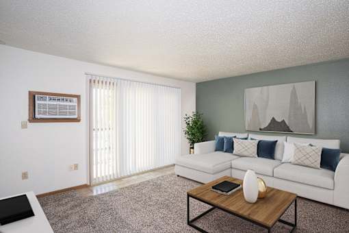 a living room with a white couch and a coffee table. Fargo, ND Pacific Park 2 Apartments