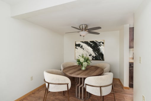 a dining room with a table with four chairs around it.  Golden Valley, MN Valley View Apartments