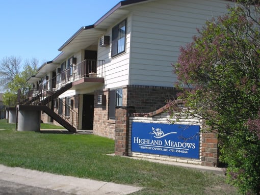 The exterior of a two level apartment building at Highland Meadows in Bismarck, ND