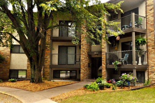 White Bear Lake, MN White Bear Terrace Apartments.  an apartment building with a large tree in front of it