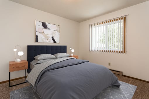 Grand Forks, ND Washington Apartments. a bedroom with a bed and two night stands with a window