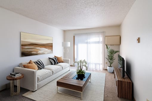 a living room with a couch and a coffee table. Grand Forks, ND Chandler 1866 Apartments