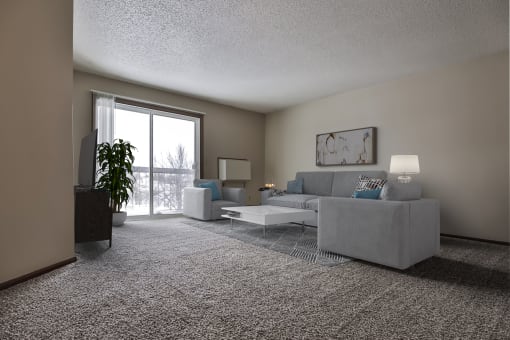 Grand Forks Primrose Apartments.  a living room with a couch and a chair with a glass sliding door