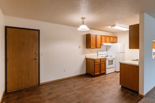 Grand Forks, ND Southview Apartments. A dining room with an entry door and the kitchen.