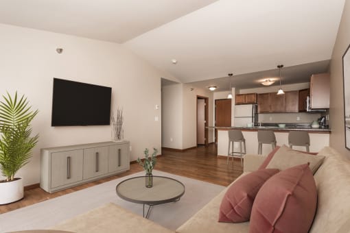 Apartments. a living room with a couch and a table  at Sterling Pointe, Grand Forks, 58201