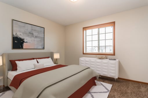 a bedroom with a bed and a window  at Sterling Pointe, Grand Forks, 58201