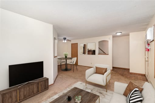 a living room with a couch and a tv. Hutchinson, MN Twin Oaks