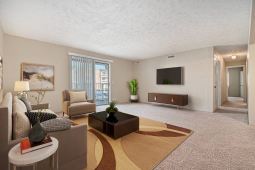 Omaha, NE Evergreen Terrace Apartments. A living room filled with furniture and a flat screen tv