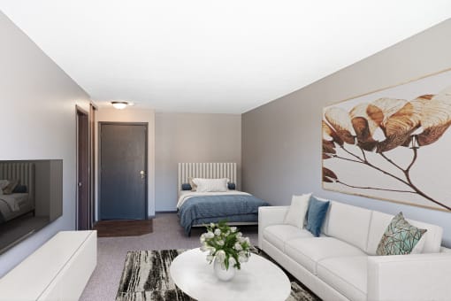 a living room with a couch and a coffee table and a bed. Roseville, MN Rosedale Apartments