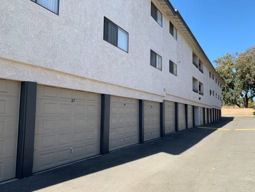 a row of garage doors on the side of a building