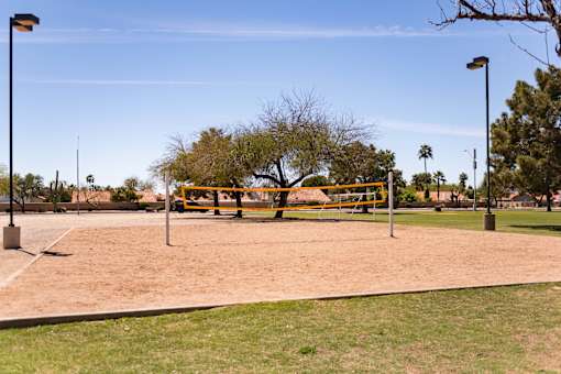 a volleyball court in the middle of a park