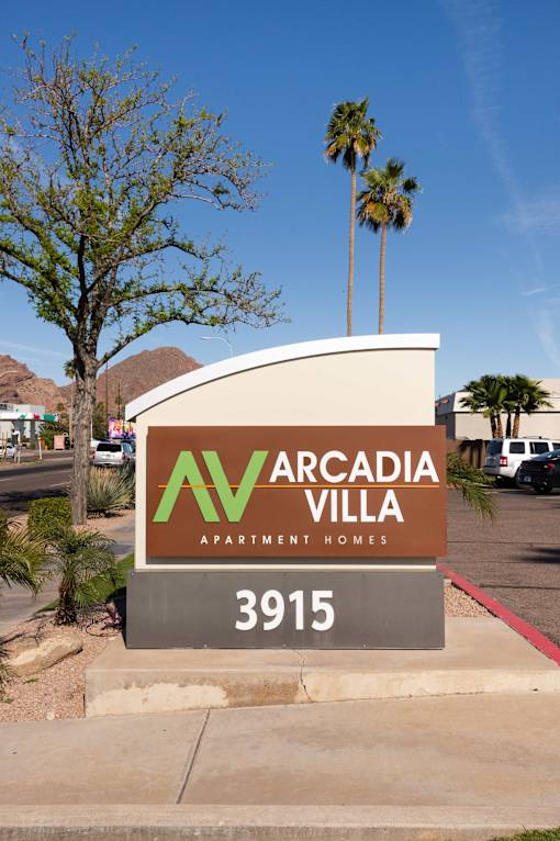 the sign apartment homes in front of a parking lot