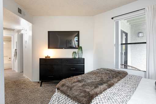 the preserve at ballantyne commons bedroom with large bed and tv