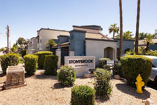 a home for sale is shown with a sign in front