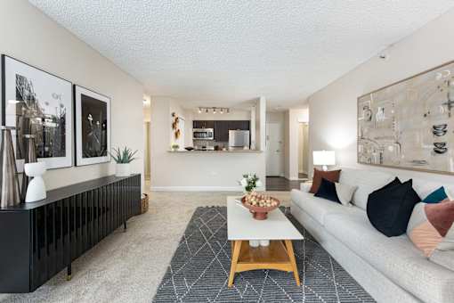 a living room with a white couch and a coffee table