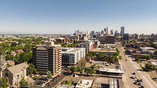 A cityscape with a clear blue sky above.