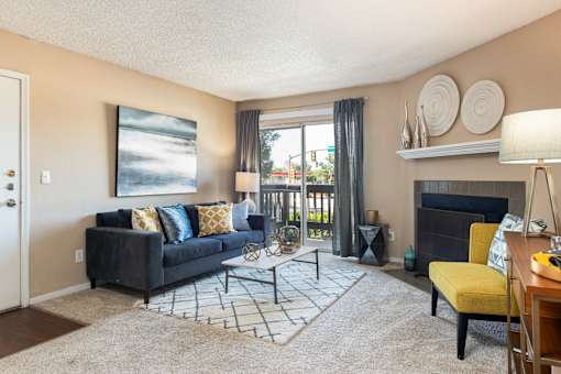 a living room with a couch and a fireplace