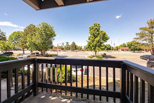 the view from the deck of a building overlooking a parking lot