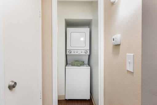 a small laundry room with a washer and dryer in it